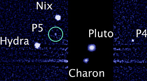 переданная «Хабблом» фотография Плутона и его спутников